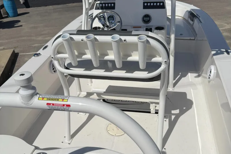 Slide: The Image of 2025 Robalo 206 Cayman boat interior with rod holders and steering console. - 8