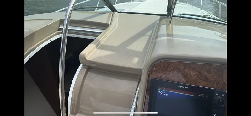 Slide: The Image of 2018 Formula 370 Super Sport boat dashboard with navigation display and sleek design. - 12