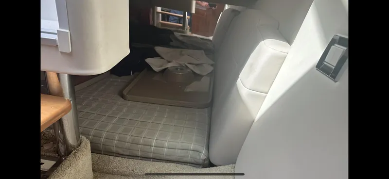 Slide: The Image of Interior cabin of a 2018 Formula 370 Super Sport boat, featuring seating and storage. - 17