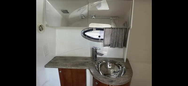 Slide: The Image of 2018 Formula 370 Super Sport bathroom with modern sink and mirror. - 22