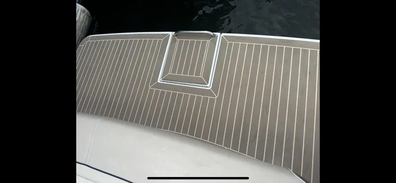 Slide: The Image of 2018 Formula 370 Super Sport boat deck with sleek wood finish. - 24