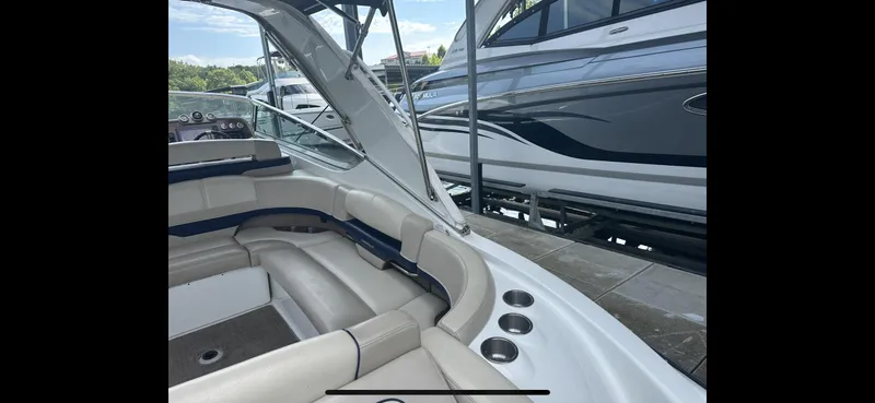 Slide: The Image of 2018 Formula 370 Super Sport boat interior with beige seating and cup holders. - 26