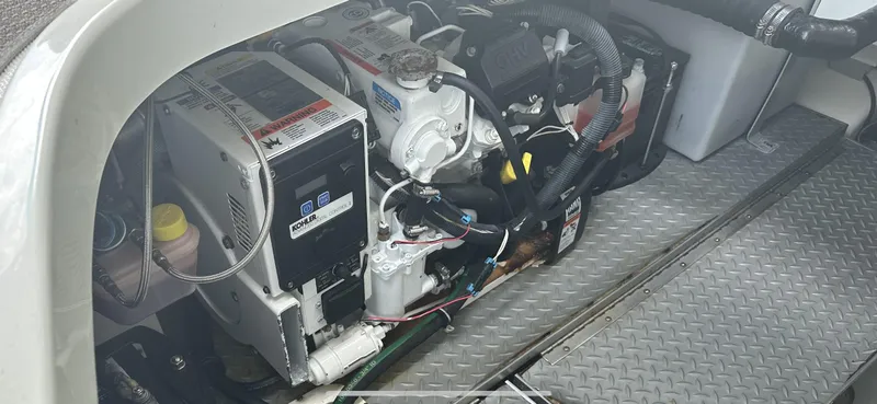 Slide: The Image of Engine compartment of a 2018 Formula 370 Super Sport boat, featuring a Kohler generator. - 7