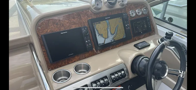 Slide: The Image of 2018 Formula 370 Super Sport dashboard with navigation screens and controls. - 8