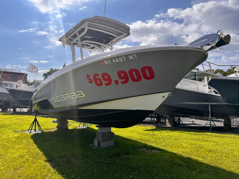 Slide: The Image of 2023 Wellcraft 222 Fisherman boat for sale, priced at $69,900, displayed outdoors. - 2