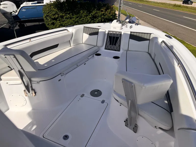 Slide: The Image of 2023 Wellcraft 222 Fisherman boat interior with seating and storage compartments. - 9