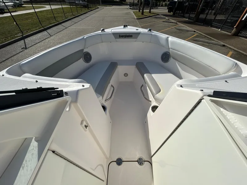 Slide: The Image of 2013 Everglades 230 Dual Console boat interior with seating and speakers. - 15