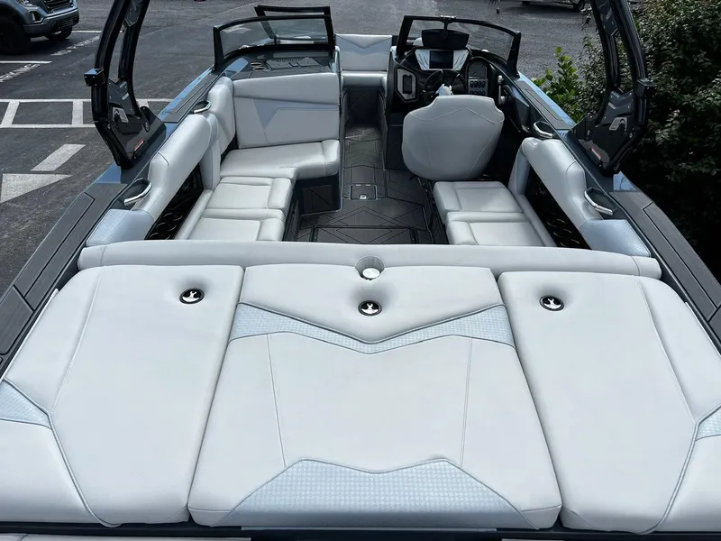 Slide: The Image of 2024 Supreme S220 boat interior with luxurious seating and modern design. - 12
