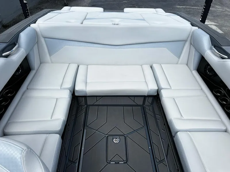 Slide: The Image of Luxurious interior of 2024 Supreme S220 boat with white seating and sleek design. - 17