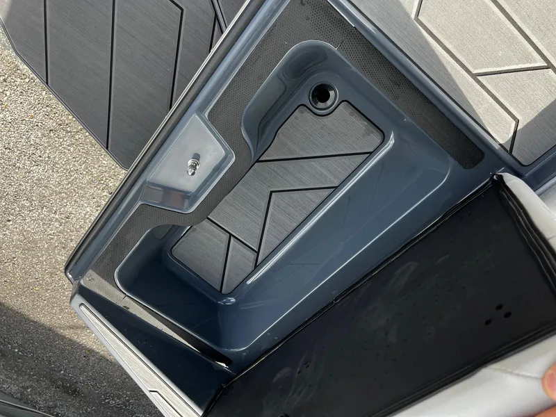 Slide: The Image of 2024 Supreme S220 boat storage compartment with sleek design and modern materials. - 21
