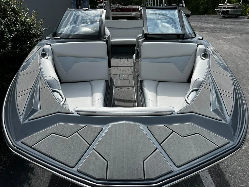 Slide: The Image of 2024 Supreme S220 boat with sleek design and spacious seating. - 8