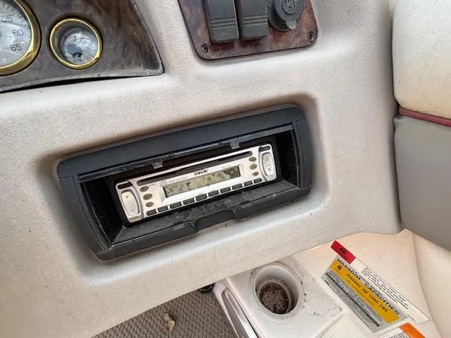 Slide: The Image of 2002 Four Winns 190 Horizon dashboard with a Sony stereo system. - 13