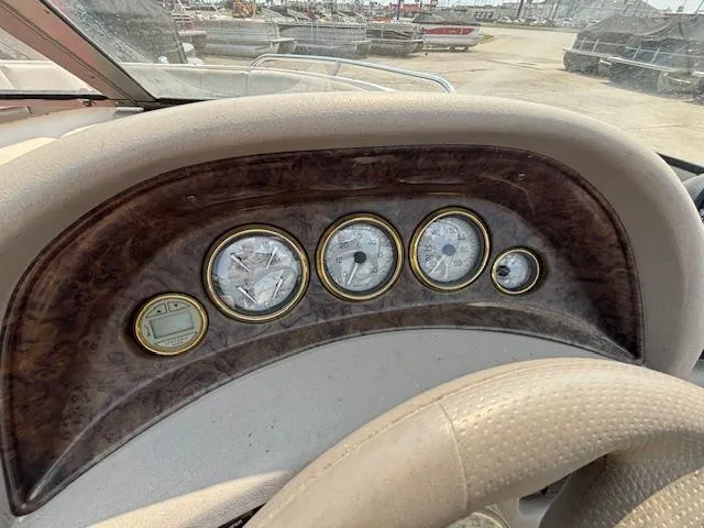Slide: The Image of Dashboard of 2002 Four Winns 190 Horizon boat with gauges and steering wheel. - 14