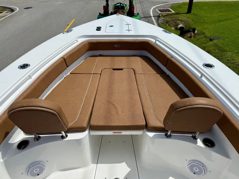 Slide: The Image of 2023 Sea Hunt Gamefish 27 Forward Seating with brown cushions, showcasing spacious and comfortable design. - 15