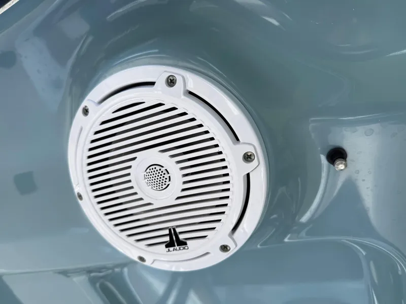 Slide: The Image of White JL Audio speaker on 2023 Sea Hunt Gamefish 27 boat interior. - 20