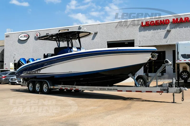 Slide: The Image of 2023 Statement 350 Open boat on trailer at Legend Marine dealership. - 1