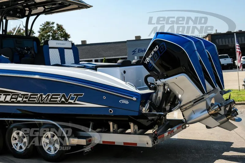 Slide: The Image of 2023 Statement 350 Open boat with triple outboard engines on a trailer. - 10