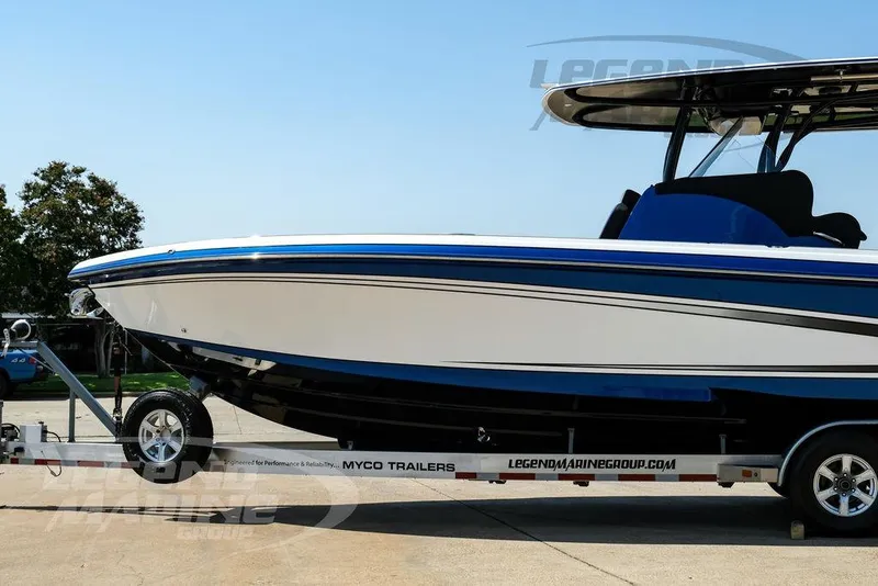 Slide: The Image of 2023 Statement 350 Open boat on trailer, sleek design, blue and white color scheme. - 14