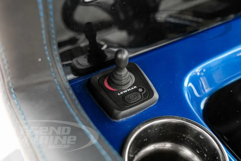 Slide: The Image of Joystick control on 2023 Statement 350 Open boat dashboard, featuring blue and black design. - 19