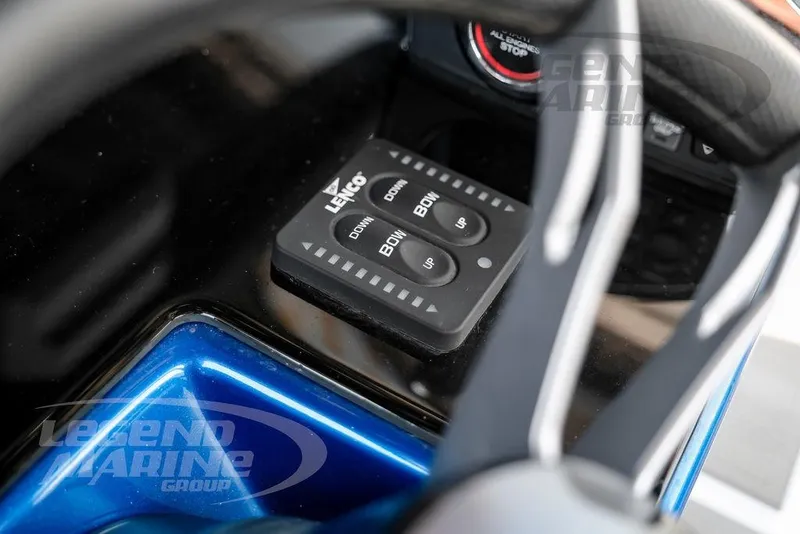 Slide: The Image of Control panel of 2023 Statement 350 Open boat with Lenco trim tab switches. - 20