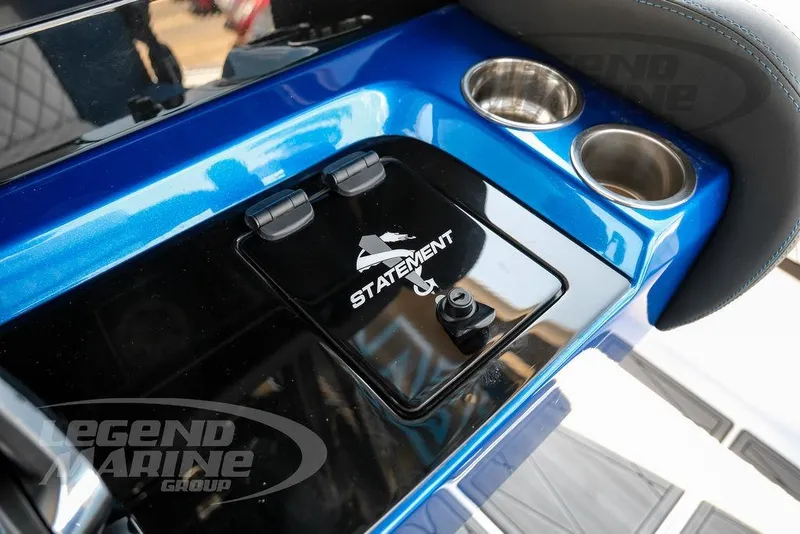 Slide: The Image of 2023 Statement 350 Open boat console with cup holders and logo. - 24