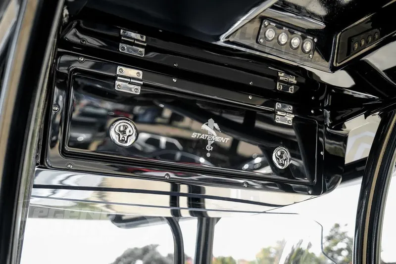 Slide: The Image of 2023 Statement 350 Open boat dashboard with sleek black finish and control panel. - 28