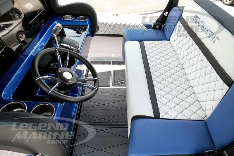 Slide: The Image of Interior of 2023 Statement 350 Open boat with blue and white seating and steering wheel. - 30