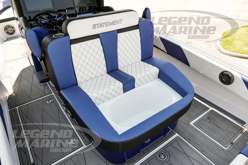 Slide: The Image of 2023 Statement 350 Open boat interior with blue and white seating, luxury design. - 35