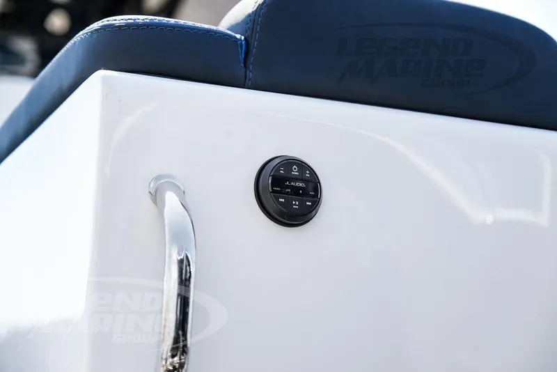 Slide: The Image of 2023 Statement 350 Open boat interior with JL Audio control panel and blue seating. - 40