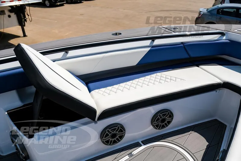 Slide: The Image of 2023 Statement 350 Open boat interior with blue and white seating and speaker system. - 41
