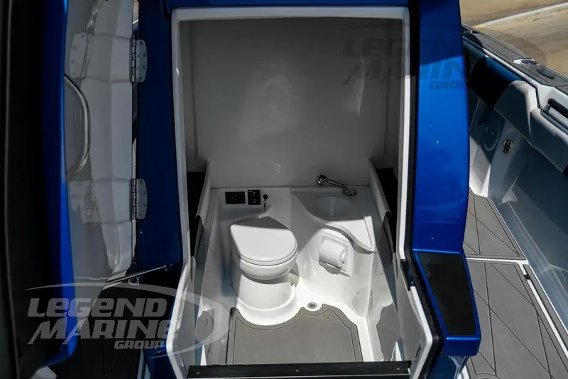 Slide: The Image of 2023 Statement 350 Open boat interior with compact bathroom and toilet. - 49