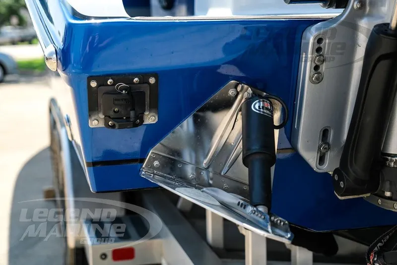 Slide: The Image of Close-up of 2023 Statement 350 Open boat's blue hull and trim tab details. - 55