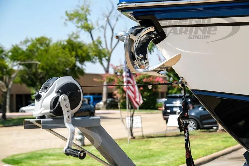 Slide: The Image of 2023 Statement 350 Open boat with anchor and winch, parked outdoors. - 56