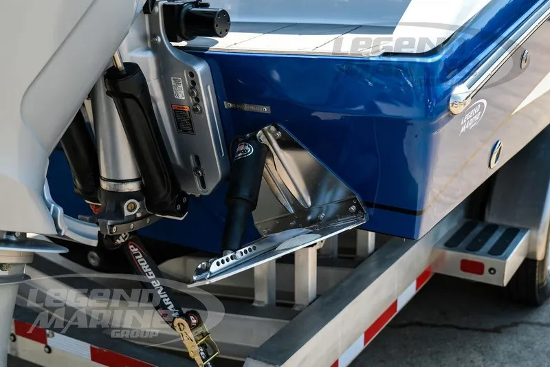 Slide: The Image of 2023 Statement 350 Open boat on trailer, featuring blue hull and outboard motor. - 60