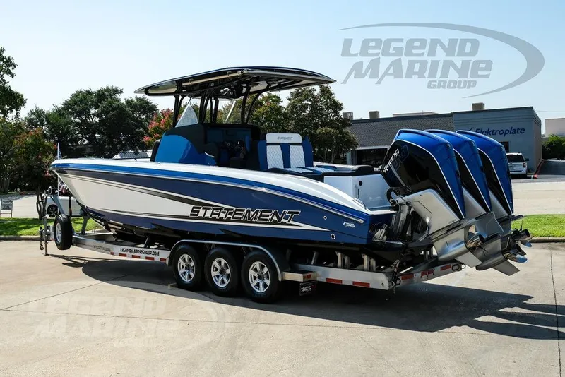 Slide: The Image of 2023 Statement 350 Open boat with triple engines on a trailer at Legend Marine Group. - 9