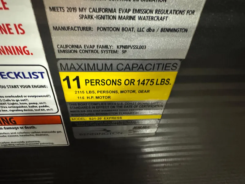 Slide: The Image of 2019 Bennington S21 capacity label: 11 persons or 1475 lbs, 116 HP motor. - 14