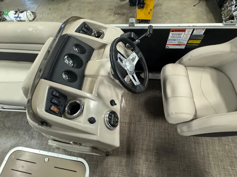 Slide: The Image of 2019 Bennington S21 boat interior with steering wheel and control panel. - 16