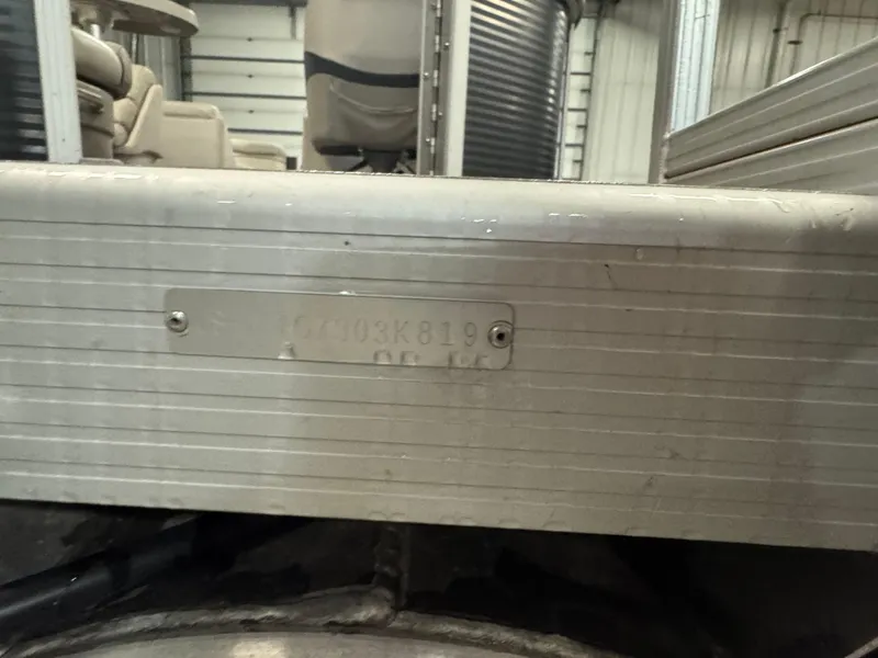 Slide: The Image of 2019 Bennington S21 boat hull identification number plate in a storage facility. - 6