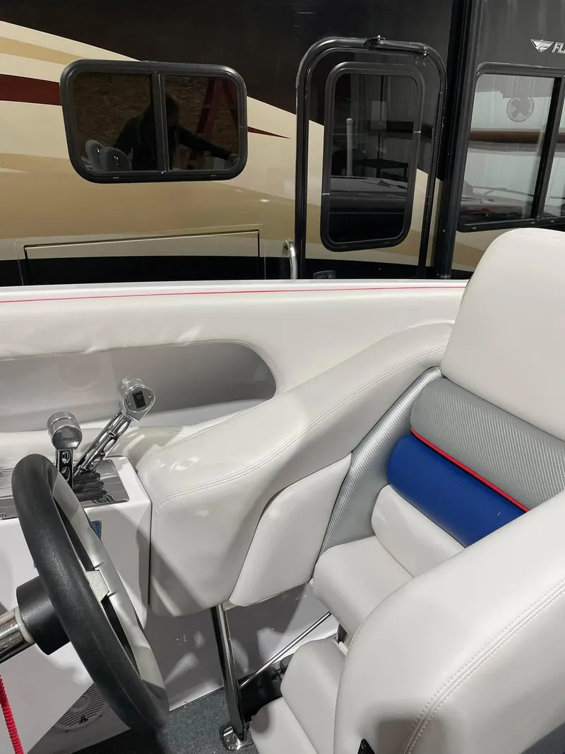 Slide: The Image of Interior of a 2008 Donzi 38 ZR boat with white and blue seating. - 14