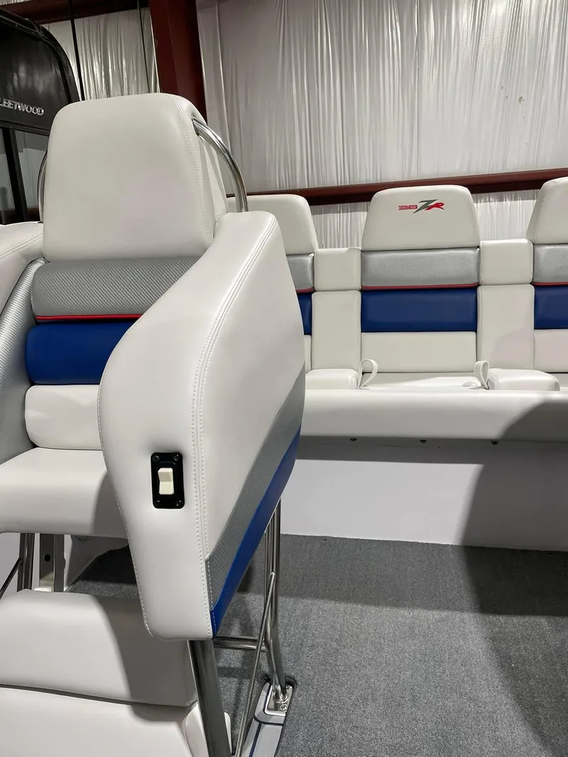 Slide: The Image of 2008 Donzi 38 ZR boat interior with white, blue, and red seating. - 5