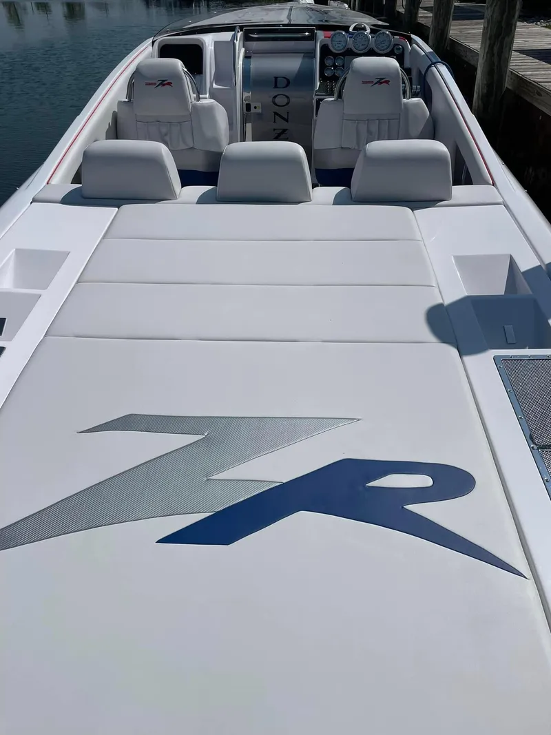 Slide: The Image of 2008 Donzi 38 ZR speedboat interior with white seating and ZR logo. - 9