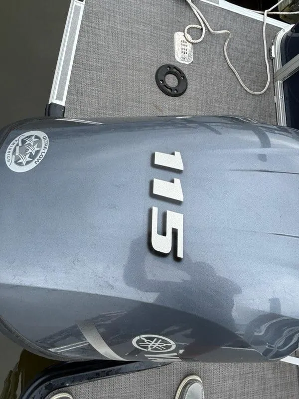 Slide: The Image of Outboard motor on 2022 Sylvan Mirage 8522 Resorter boat, featuring "115" horsepower. - 11