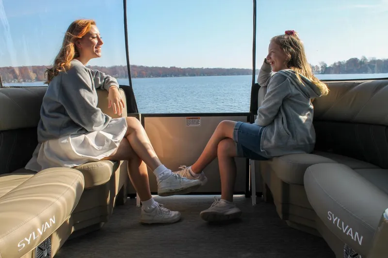 Slide: The Image of Manufacturer Provided Image: Two people enjoying a ride on a 2022 Sylvan Mirage 8522 Resorter boat. - 12