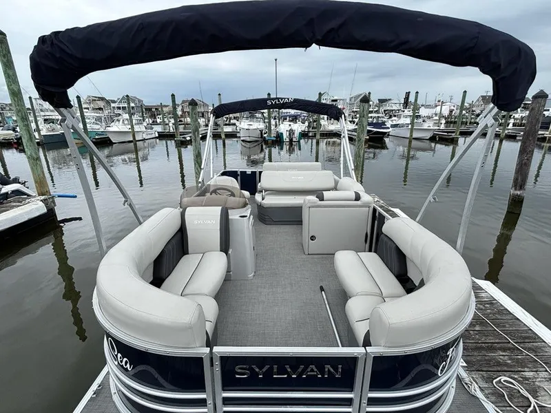 Slide: The Image of 2022 Sylvan Mirage 8522 Resorter pontoon boat docked at marina. - 3