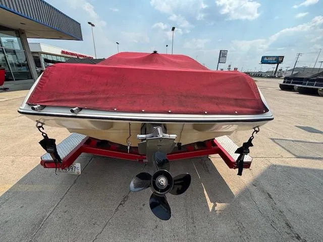Slide: The Image of 2006 Stingray 220 LX boat with red cover on trailer, rear view. - 4