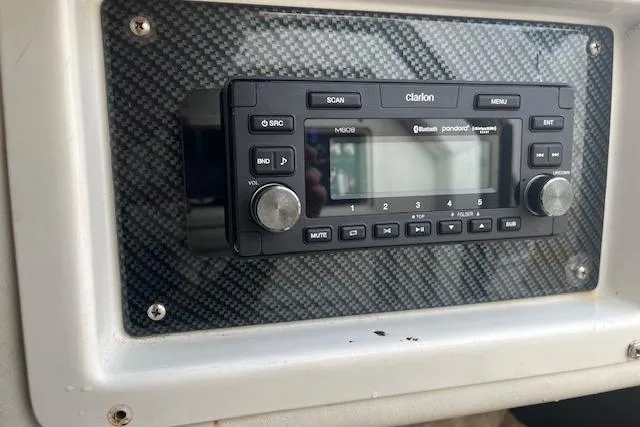 Slide: The Image of Clarion stereo system in 2000 Cigarette Top Gun T/S 38 boat dashboard. - 10