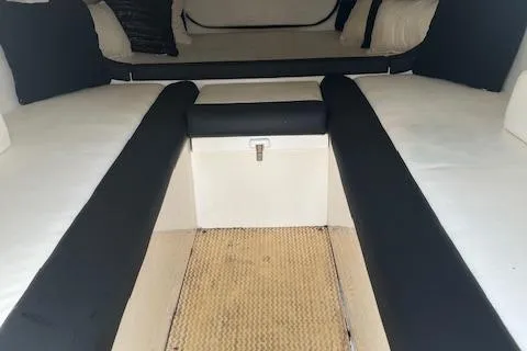 Slide: The Image of Interior of 2000 Cigarette Top Gun T/S 38 boat, featuring cushioned seating. - 11