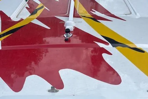 Slide: The Image of 2000 Cigarette Top Gun T/S 38 boat with vibrant red and yellow design. - 4