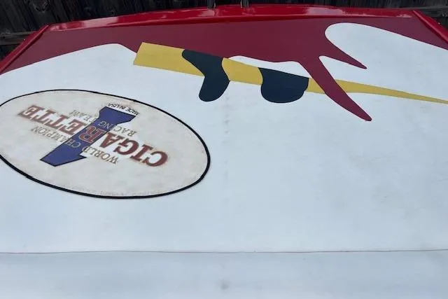 Slide: The Image of Cigarette Top Gun T/S 38 boat, 2000 model, featuring bold graphics and racing logo. - 5