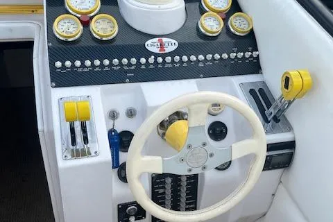 Slide: The Image of Cockpit of 2000 Cigarette Top Gun T/S 38 with steering wheel and gauges. - 8